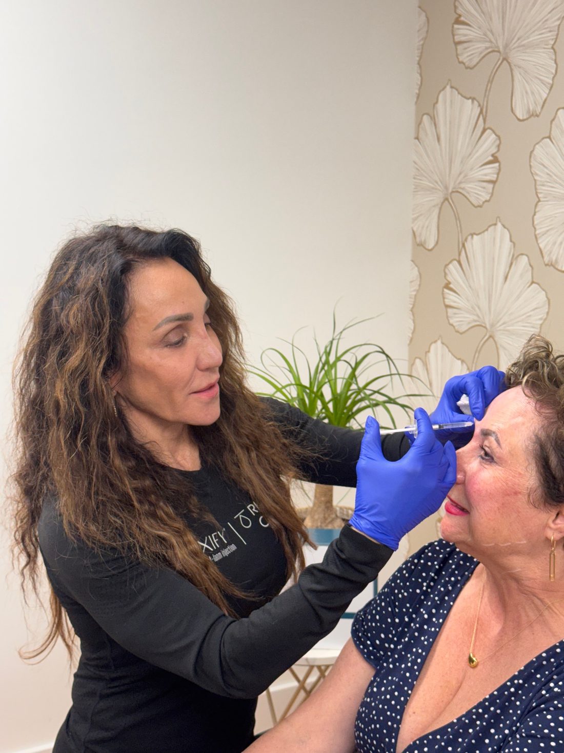 Kelli Kleckner administering a neurotoxin treatment to a patient at TRU Integrative Wellness